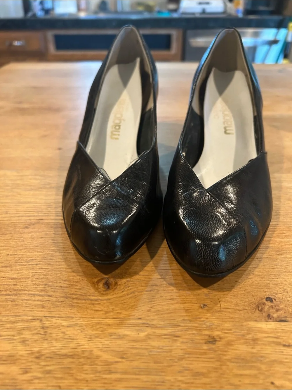 Black Leather Pointed-Toe Wedge Pumps